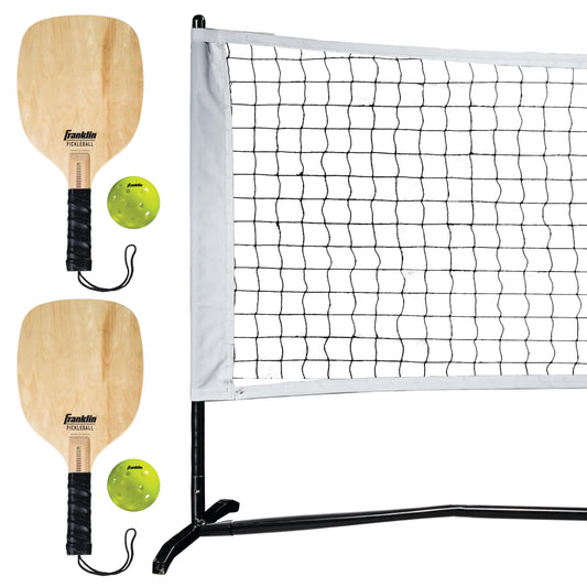 Franklin Sports Pickleball Net Set with two wooden paddles and two pickleballs on a portable outdoor net