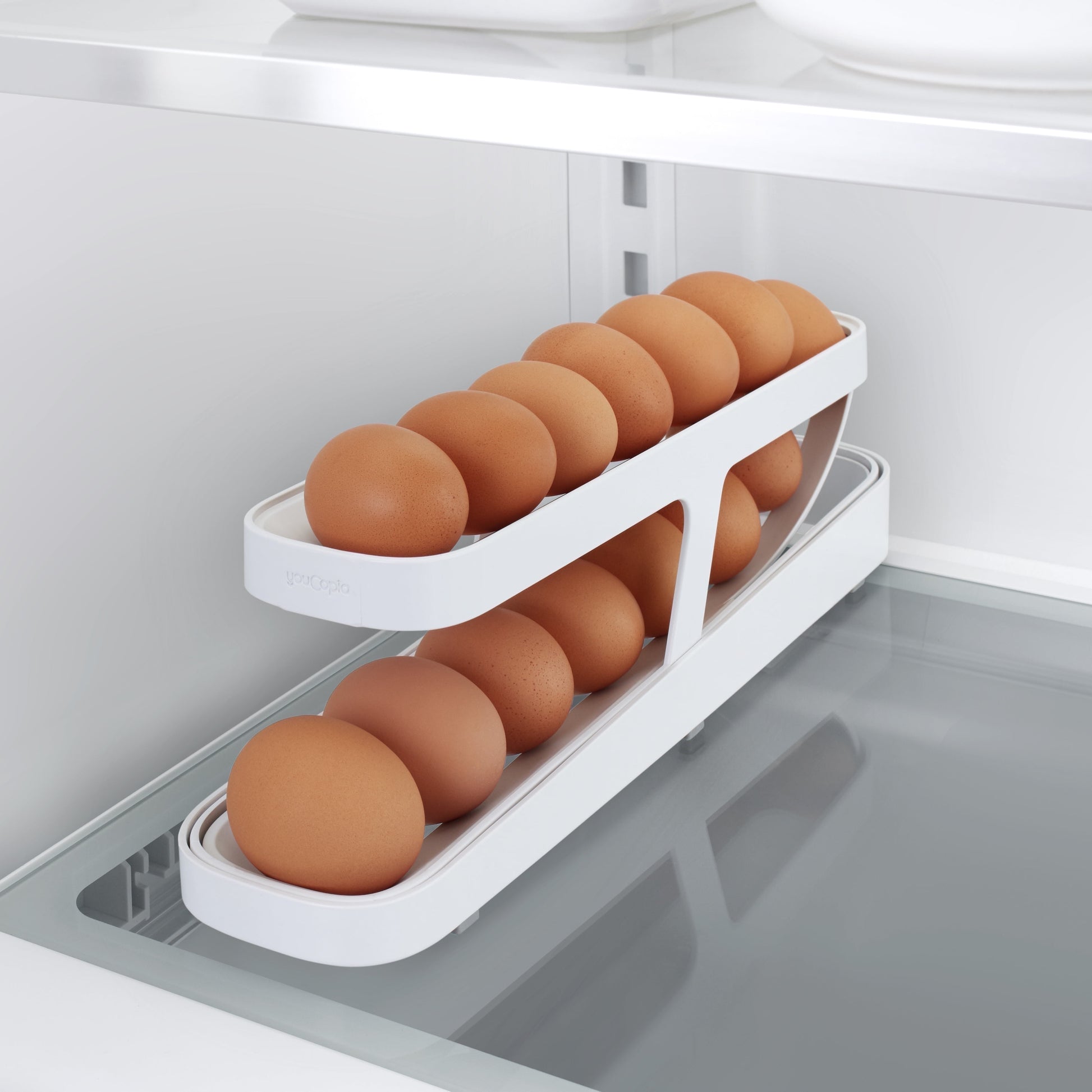 YouCopia RollDown egg dispenser, a space-saving rolling organizer for fridge