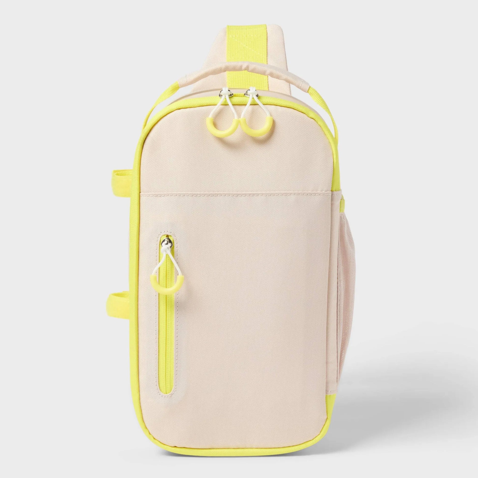 Soft-sided cooler in beige and yellow with zip closure, adjustable straps, and outside storage pocket