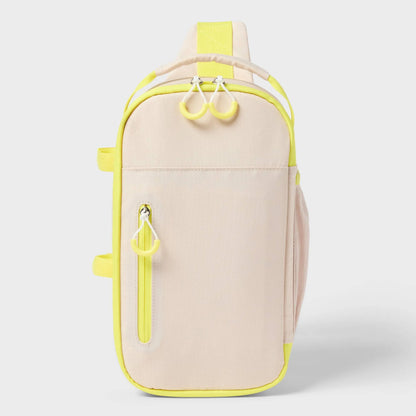 Soft-sided cooler in beige and yellow with zip closure, adjustable straps, and outside storage pocket